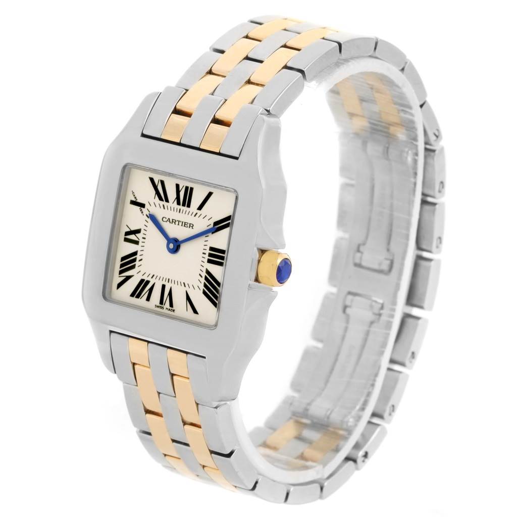 This Cartier Santos Demoiselle W25067Z6 Women's Steel and Gold (two tone) Silver Dial W25067Z6 Women's Steel and Gold (two tone) Silver Dial watch is shown at an angled view, displaying its face, bezel, crown, and bracelet.