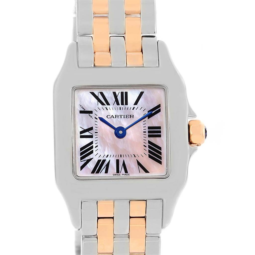The image shows a close-up of the dial, bezel, and part of the bracelet of the Cartier Santos Demoiselle W25074Y9 Women's Steel and Gold (two tone) Mother of Pearl Dial W25074Y9 Women's Steel and Gold (two tone) Mother of Pearl Dial watch.
