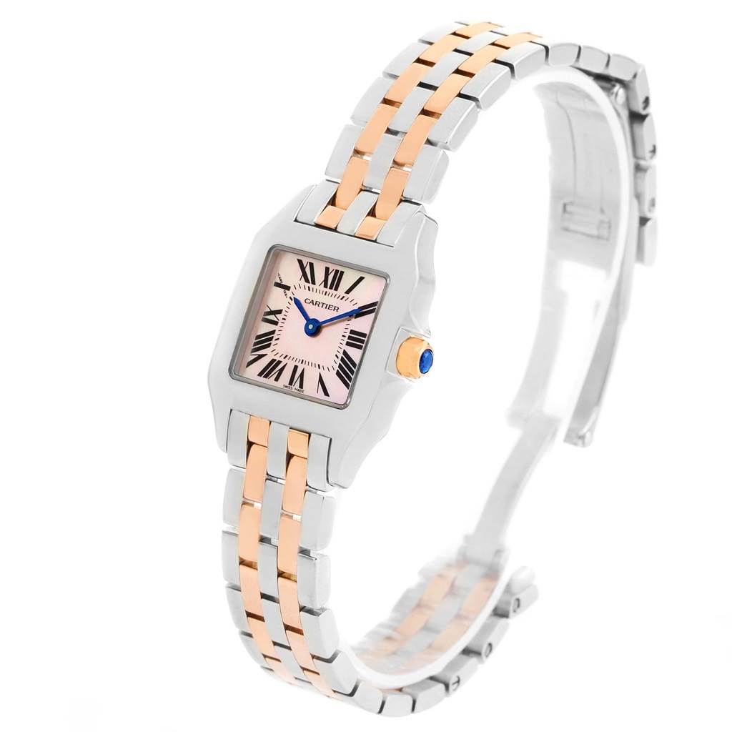 The image shows a Santos Demoiselle watch by Cartier from an angled side view, displaying the face, bezel, and bracelet.
