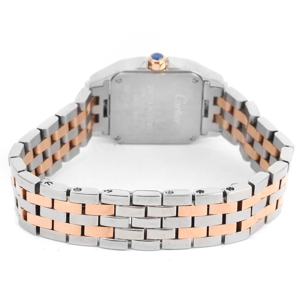 This image shows the back of the Cartier Santos Demoiselle W25074Y9 Women's Steel and Gold (two tone) Mother of Pearl Dial W25074Y9 Women's Steel and Gold (two tone) Mother of Pearl Dial watch, highlighting its two-tone metal bracelet and case.