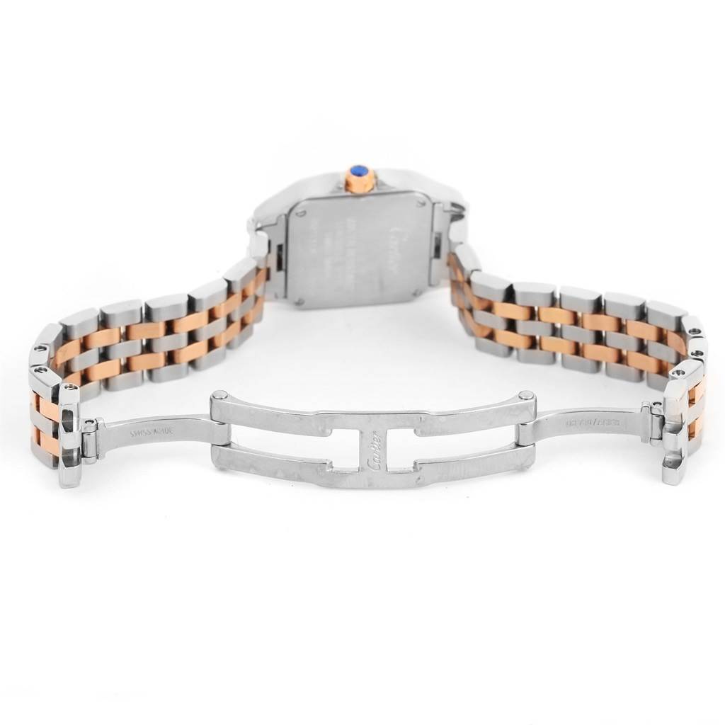 The image shows the open clasp and underside of the two-tone bracelet of a Cartier Santos Demoiselle W25074Y9 Women's Steel and Gold (two tone) Mother of Pearl Dial W25074Y9 Women's Steel and Gold (two tone) Mother of Pearl Dial watch.