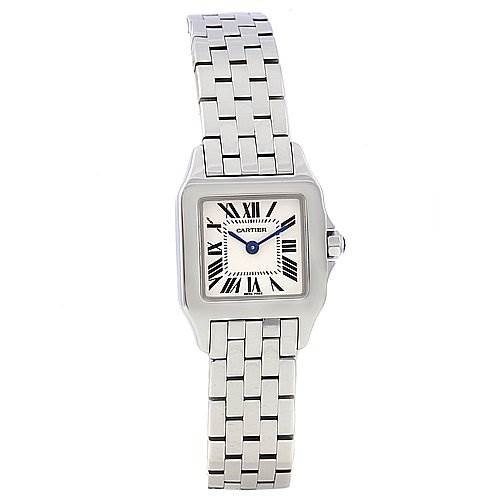 The image shows a front view of a Cartier Santos Demoiselle W25064Z5 Women's Stainless Steel White Dial W25064Z5 Women's Stainless Steel White Dial watch, highlighting its square face, Roman numerals, and metal bracelet.