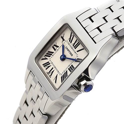 The image shows a close-up angle of the Cartier Santos Demoiselle W25064Z5 Women's Stainless Steel White Dial W25064Z5 Women's Stainless Steel White Dial watch, highlighting its face, bezel, and part of the bracelet.