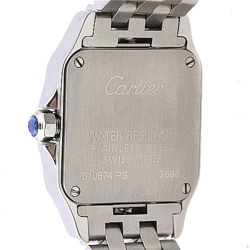 The image shows the back case and part of the bracelet of a Cartier Santos Demoiselle W25064Z5 Women's Stainless Steel White Dial W25064Z5 Women's Stainless Steel White Dial watch, featuring a screw-down case back and engraving.