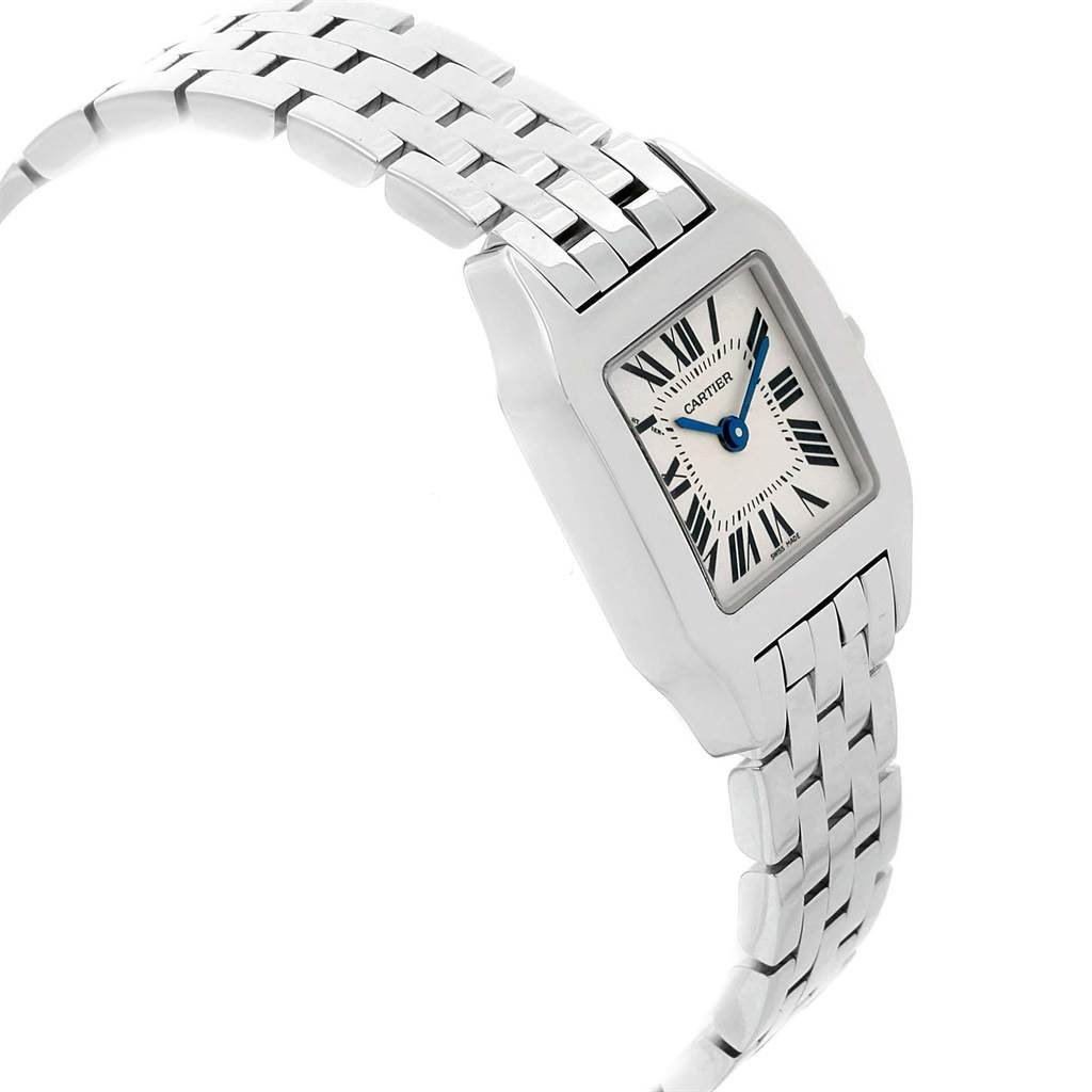 The image shows the Cartier Santos Demoiselle W25064Z5 Women
s Stainless Steel Silver Dial W25064Z5 Women
s Stainless Steel Silver Dial watch from a side angle, highlighting its face and a portion of its metal band.