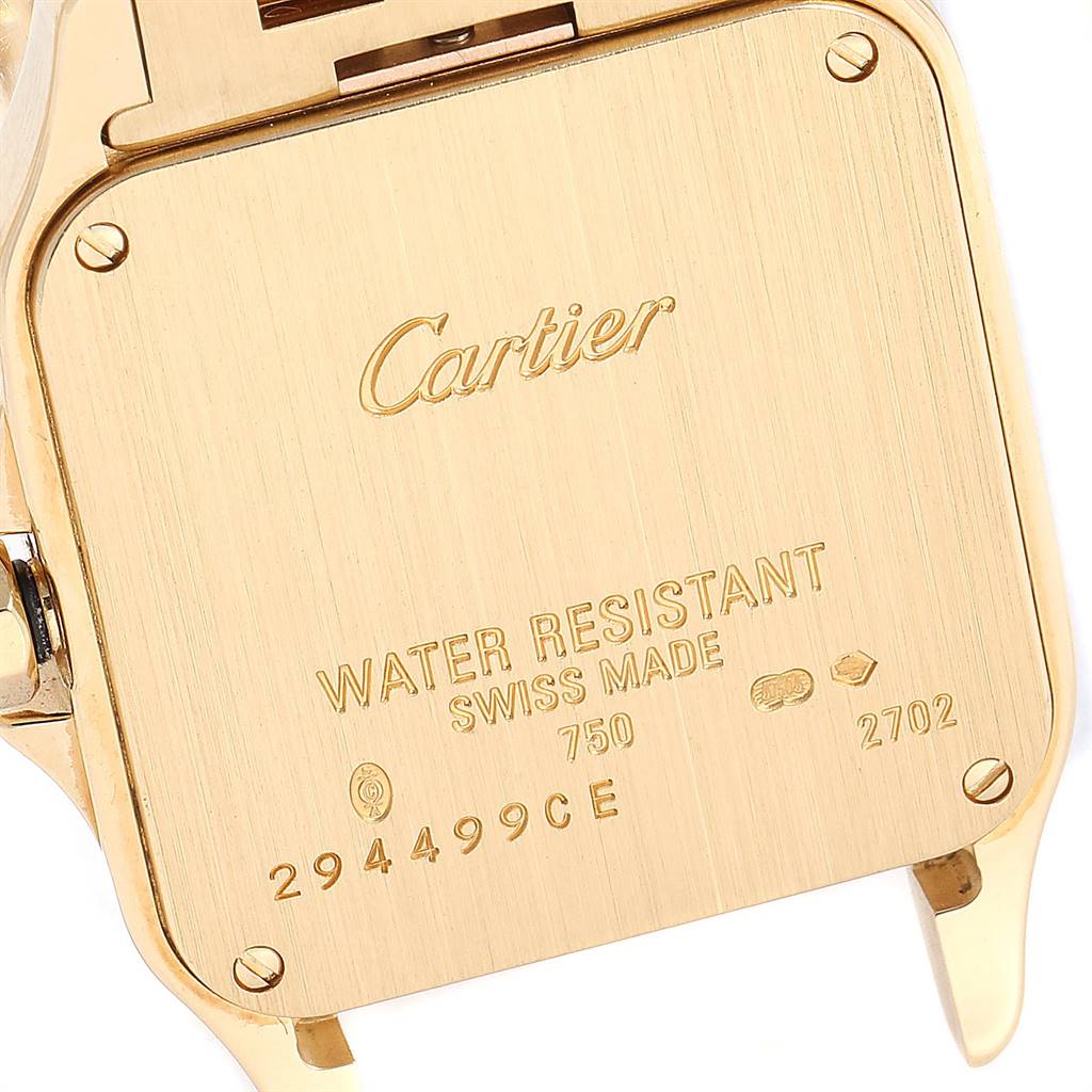 This image shows the back case of a Cartier Santos Demoiselle WF9002Y7 Women
s Yellow Gold Silver Dial WF9002Y7 Women
s Yellow Gold Silver Dial watch, highlighting inscriptions about water resistance and Best Quality
ity.