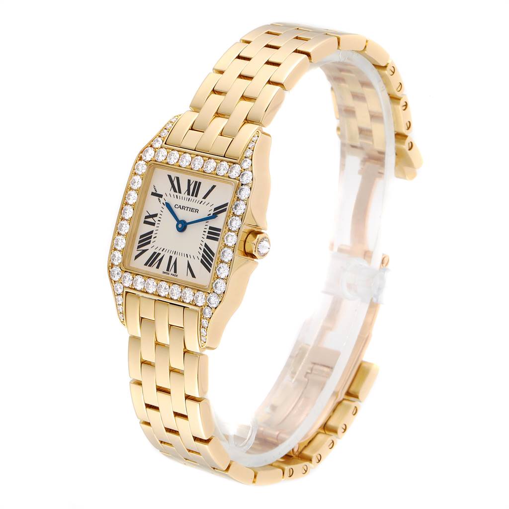 The image shows the Cartier Santos Demoiselle WF9002Y7 Women
s Yellow Gold Silver Dial WF9002Y7 Women
s Yellow Gold Silver Dial watch from a side angle, highlighting the face, bezel, and bracelet.