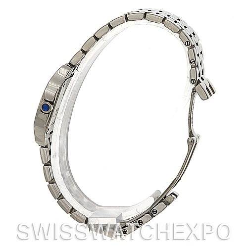 The image shows a side angle of the Cartier Santos Demoiselle W25064Z5 Women
s Stainless Steel Silver Dial W25064Z5 Women
s Stainless Steel Silver Dial watch, highlighting its bracelet, case, and crown with a blue gemstone.