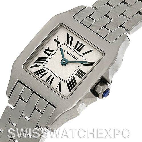 The image shows a close-up angle of the dial, bezel, crown, and part of the bracelet of a Cartier Santos Demoiselle W25064Z5 Women
s Stainless Steel Silver Dial W25064Z5 Women
s Stainless Steel Silver Dial watch.