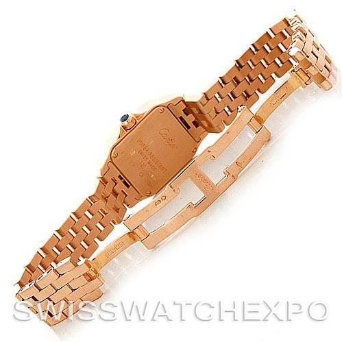 The image shows the back and bracelet of a Santos Demoiselle watch by Cartier at an angle illustrating the deployment clasp.