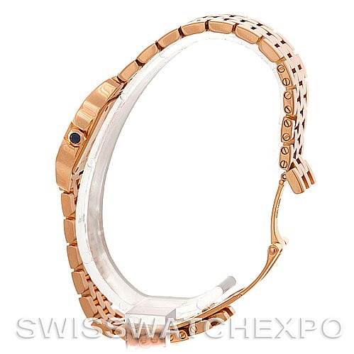 This is a side view of a Cartier Santos Demoiselle W25077X9 Women
s Rose Gold Silver Dial W25077X9 Women
s Rose Gold Silver Dial watch, showcasing its bracelet and case profile.