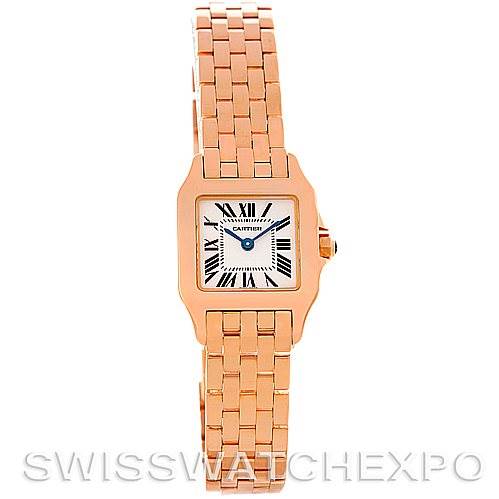 The image shows a front view of a Cartier Santos Demoiselle W25077X9 Women
s Rose Gold Silver Dial W25077X9 Women
s Rose Gold Silver Dial watch, featuring a gold bracelet and a square dial with Roman numerals.