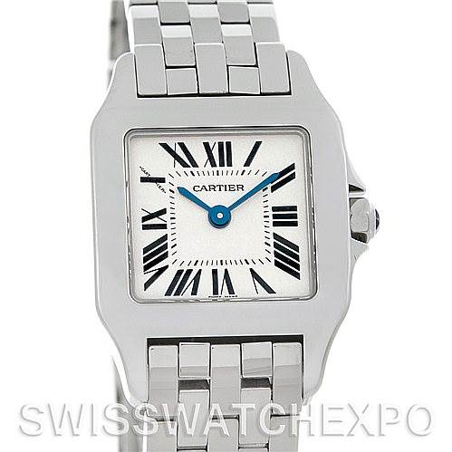 The image shows a frontal close-up of the Cartier Santos Demoiselle W25064Z5 Women's Stainless Steel Silver Dial W25064Z5 Women's Stainless Steel Silver Dial watch, highlighting its square face, Roman numerals, and metal link bracelet.