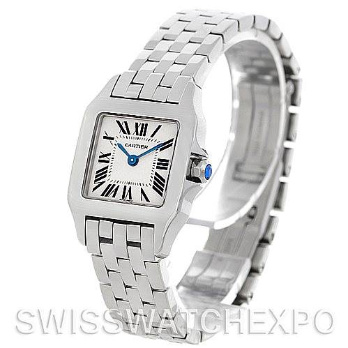 The Cartier Santos Demoiselle W25064Z5 Women's Stainless Steel Silver Dial W25064Z5 Women's Stainless Steel Silver Dial watch is shown from a three-quarter angle, highlighting its square face, bracelet, and crown.