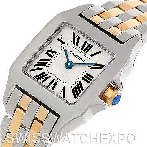 The image shows a close-up, angled view of the Cartier Santos Demoiselle W25066Z6 Women's Steel and Gold (two tone) Silver Dial W25066Z6 Women's Steel and Gold (two tone) Silver Dial watch, highlighting the face, crown, and part of the two-tone bracelet.