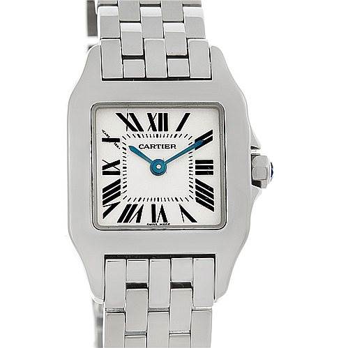 The Cartier Santos Demoiselle W25064Z5 Women
s Stainless Steel Silver Dial W25064Z5 Women
s Stainless Steel Silver Dial watch is shown from the front, displaying the face, Roman numerals, and part of the metal bracelet.