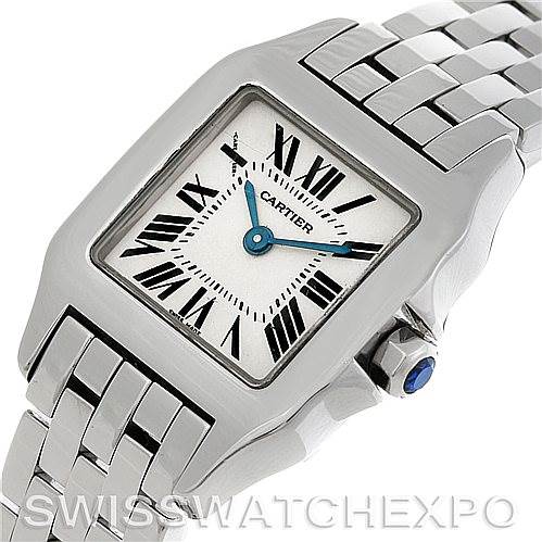 This image shows a close-up of the Cartier Santos Demoiselle W25064Z5 Women
s Stainless Steel Silver Dial W25064Z5 Women
s Stainless Steel Silver Dial watch highlighting its face, case, and part of the bracelet.