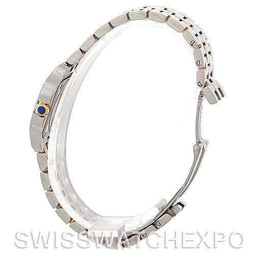 The image shows a side view of the Cartier Santos Demoiselle W25066Z6 Women's Steel and Gold (two tone) Silver Dial W25066Z6 Women's Steel and Gold (two tone) Silver Dial watch, highlighting the bracelet and crown with a blue cabochon.
