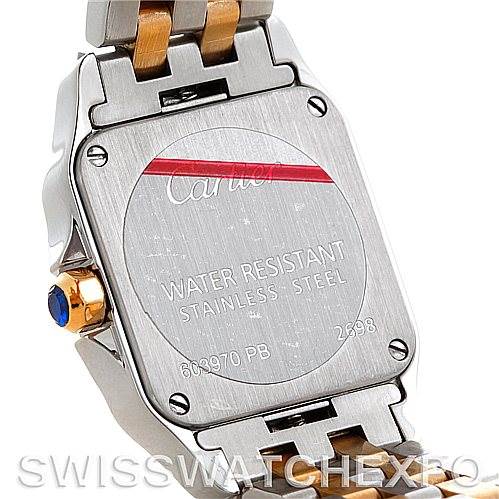 The image shows the back case and part of the bracelet of a Santos Demoiselle model by Cartier.