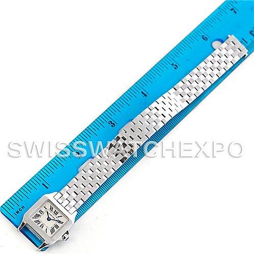 The image shows a side view of a Cartier Santos Demoiselle W25064Z5 Women's Stainless Steel Silver Dial W25064Z5 Women's Stainless Steel Silver Dial watch with its bracelet extended next to a ruler for scale.