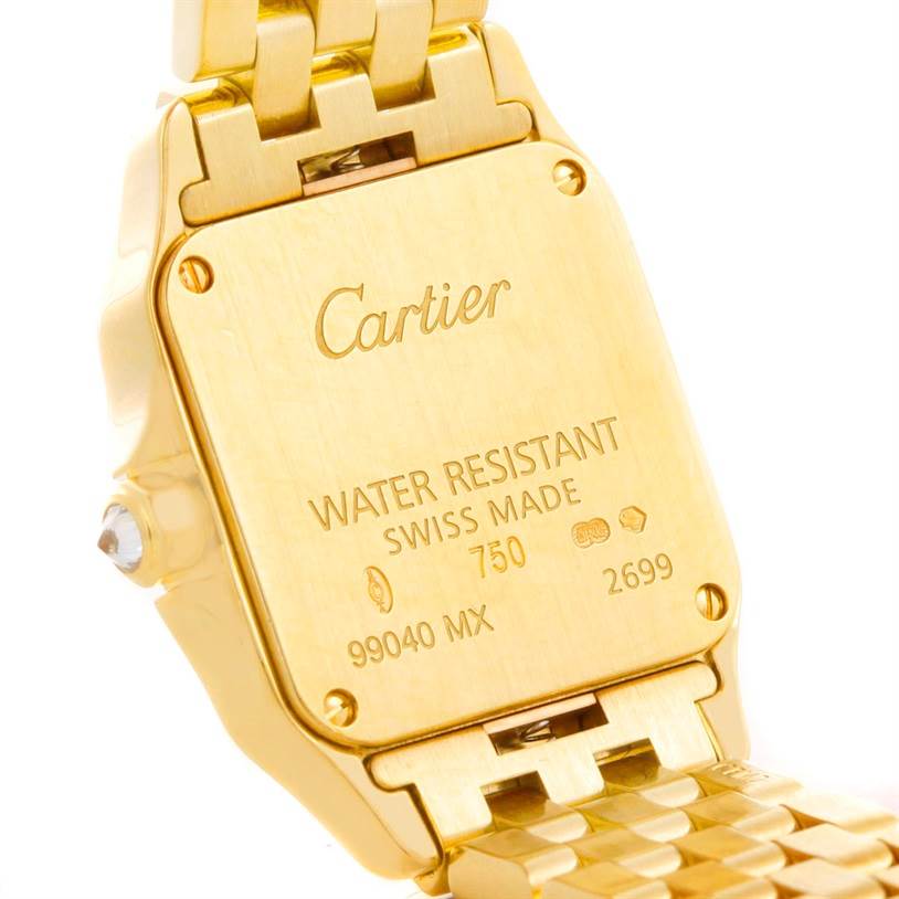 The image shows the back case and part of the bracelet of the Cartier Santos Demoiselle WF9001Y7 Women's Yellow Gold Silver Dial WF9001Y7 Women's Yellow Gold Silver Dial watch.