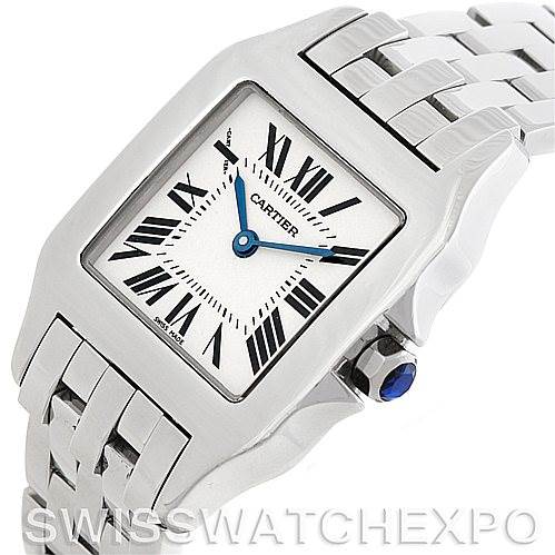 The image of the Santos Demoiselle watch by Cartier shows a close-up angle highlighting the face, bracelet, and crown with a blue sapphire.