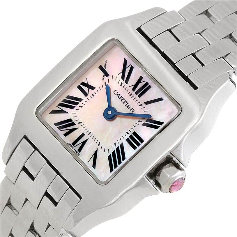 The image shows a close-up angle of a Santos Demoiselle watch by Cartier, focusing on the face, case, crown, and part of the bracelet.