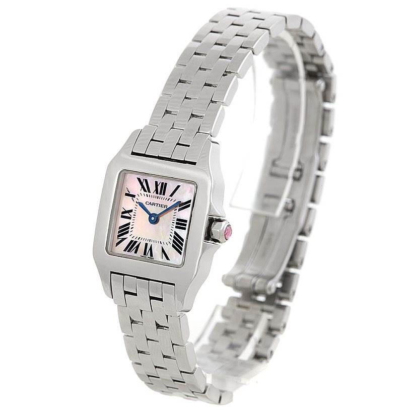 The image shows a side-angle view of a Santos Demoiselle watch by Cartier, highlighting the face, bezel, and bracelet.
