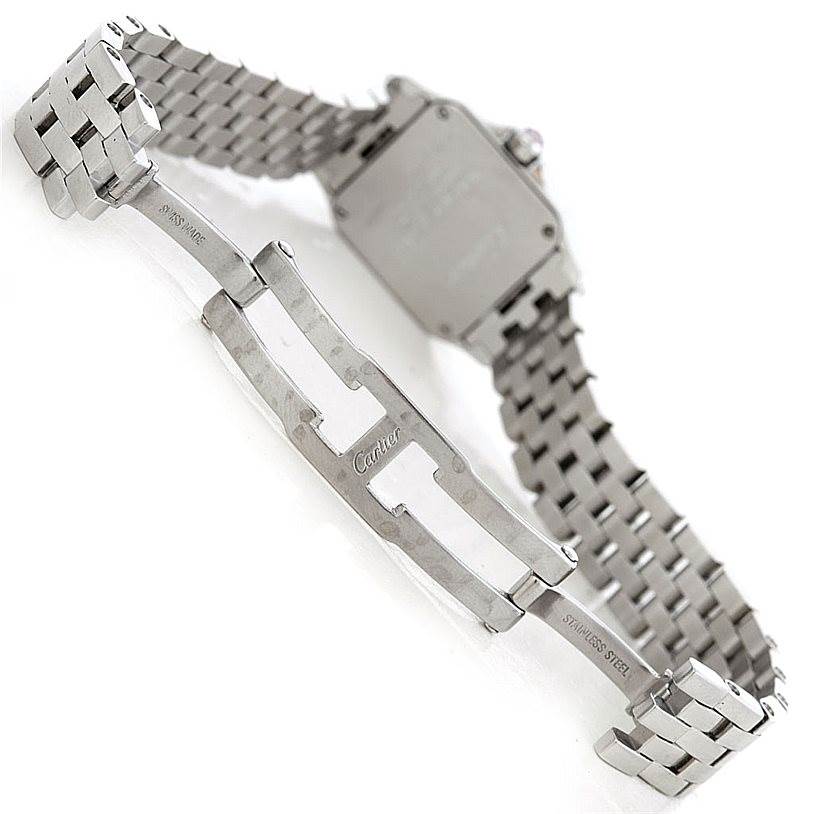 The image shows the back and clasp of a Santos Demoiselle model watch by Cartier, highlighting its stainless steel bracelet and clasp.