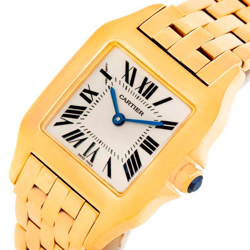 This image shows a close-up of the Cartier Santos Demoiselle W25062X9 Women's Yellow Gold Silver Dial W25062X9 Women's Yellow Gold Silver Dial watch, highlighting the dial, case, and part of the bracelet.