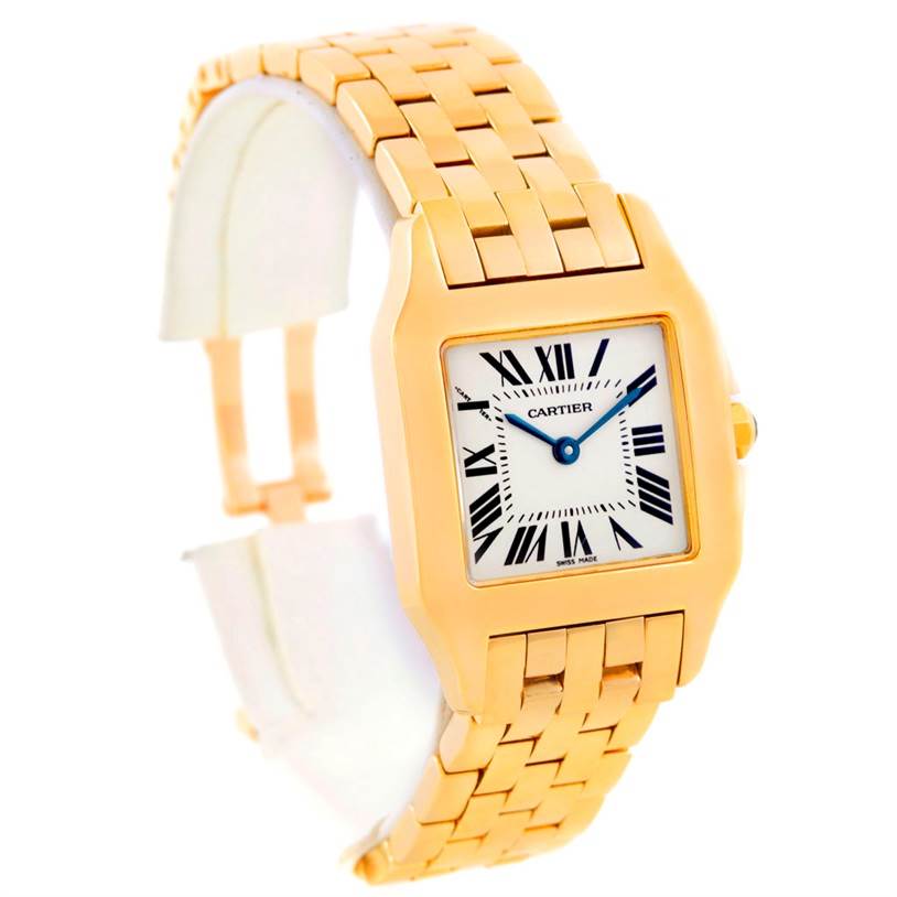 The Cartier Santos Demoiselle W25062X9 Women's Yellow Gold Silver Dial W25062X9 Women's Yellow Gold Silver Dial watch is shown at a slight angle, displaying its face, bracelet, and clasp.