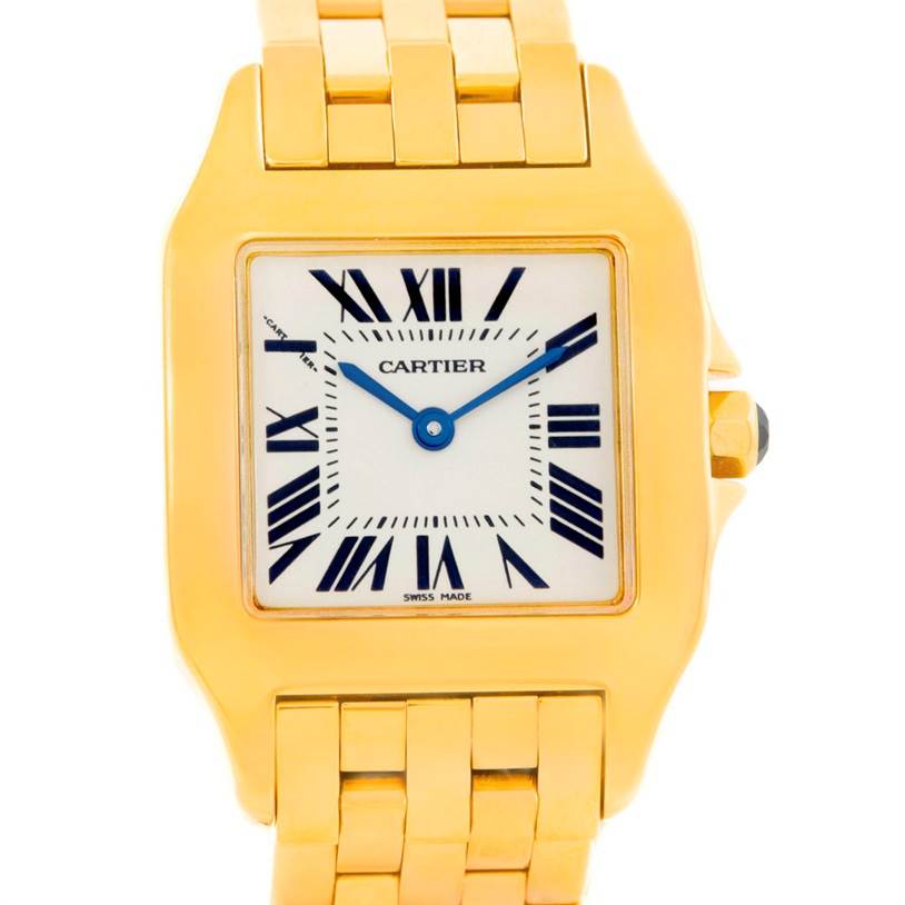 The image shows a frontal view of the Cartier Santos Demoiselle W25062X9 Women
s Yellow Gold Silver Dial W25062X9 Women
s Yellow Gold Silver Dial watch, highlighting its face, bezel, and part of the bracelet.