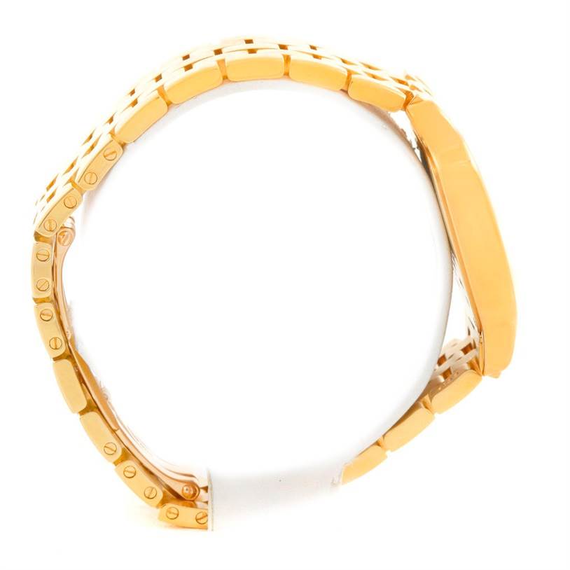 The image shows a side view of the Cartier Santos Demoiselle W25062X9 Women
s Yellow Gold Silver Dial W25062X9 Women
s Yellow Gold Silver Dial model, highlighting the bracelet and case profile.