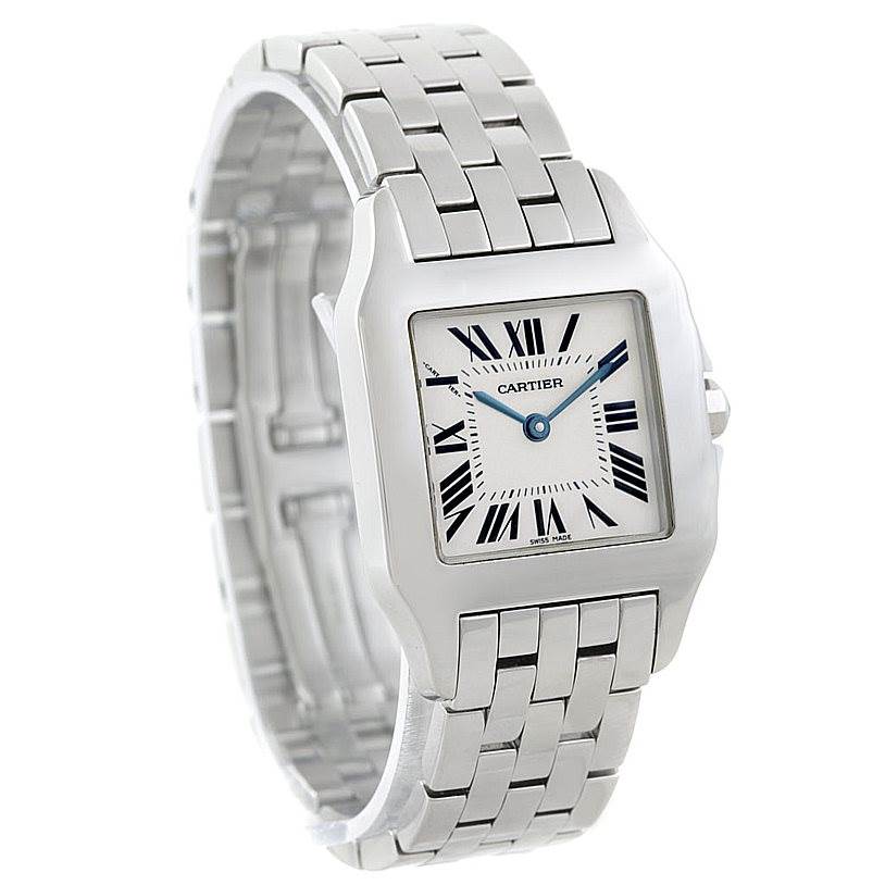 The Cartier Santos Demoiselle W25065Z5 Women's Stainless Steel Silver Dial W25065Z5 Women's Stainless Steel Silver Dial watch is shown at an angled side view highlighting the square face, Roman numerals, and metal bracelet.
