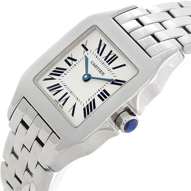 The image shows a close-up angle of the Cartier Santos Demoiselle W25065Z5 Women's Stainless Steel Silver Dial W25065Z5 Women's Stainless Steel Silver Dial watch, highlighting the face, bezel, and part of the metal bracelet.