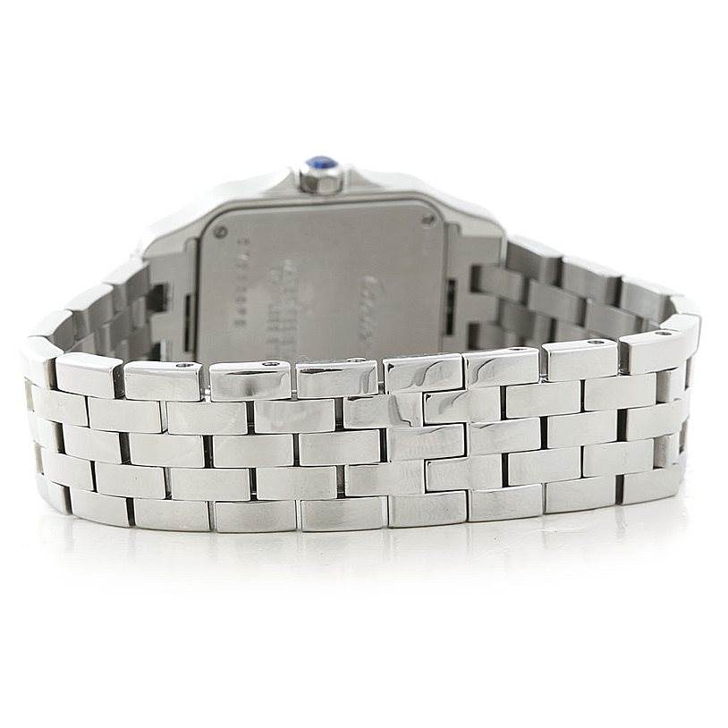 The image shows the back of the Santos Demoiselle watch by Cartier, focusing on the case back and metal bracelet.