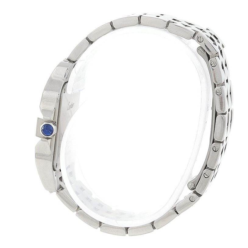 The image shows a side view of the Santos Demoiselle watch by Cartier, highlighting the bracelet and crown with a blue gem.