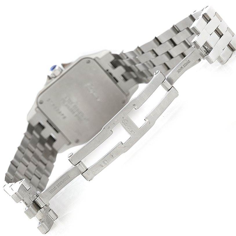 The image shows the back of the Santos Demoiselle watch by Cartier, highlighting its bracelet and clasp.