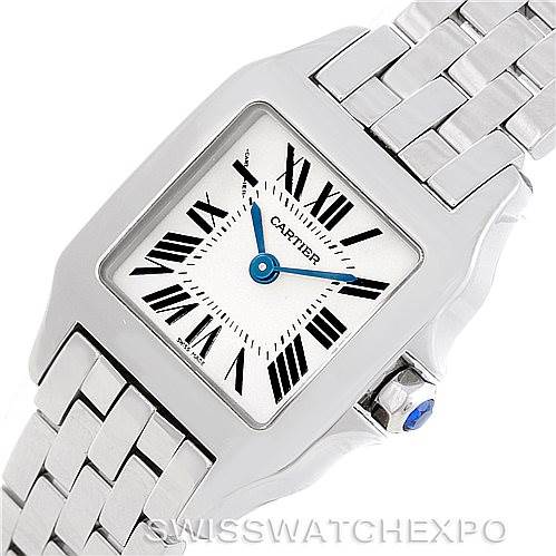 The image shows a close-up of the Cartier Santos Demoiselle W25064Z5 Women's Stainless Steel Silver Dial W25064Z5 Women's Stainless Steel Silver Dial watch, highlighting the face, bezel, crown, and part of the bracelet.