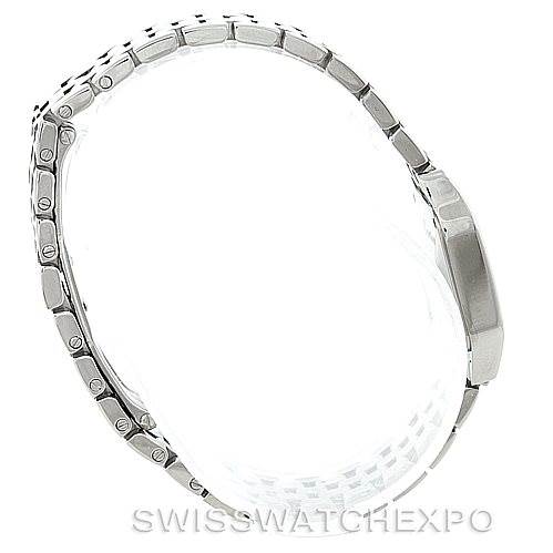 The image shows a side view of a Santos Demoiselle watch by Cartier, focusing on the metal bracelet and the side profile of the case.