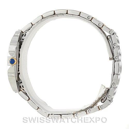 This image shows a side view of the Cartier Santos Demoiselle W25067Z6 Women's Steel and Gold (two tone) Silver Dial W25067Z6 Women's Steel and Gold (two tone) Silver Dial watch, highlighting its metal bracelet and crown with a blue cabochon.
