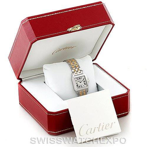 The Cartier Santos Demoiselle W25067Z6 Women's Steel and Gold (two tone) Silver Dial W25067Z6 Women's Steel and Gold (two tone) Silver Dial watch is shown in an open red box with a white interior and an accompanying Cartier booklet.