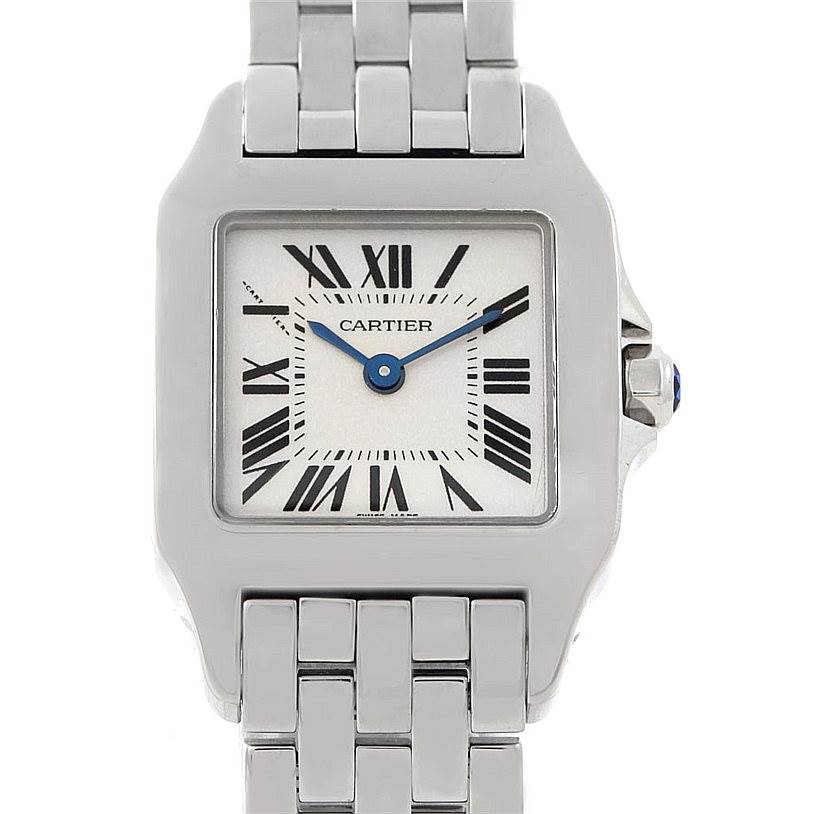 The image shows a frontal view of a Cartier Santos Demoiselle W25064Z5 Women
s Stainless Steel Silver Dial W25064Z5 Women
s Stainless Steel Silver Dial watch, highlighting its square face, Roman numerals, and metal bracelet.