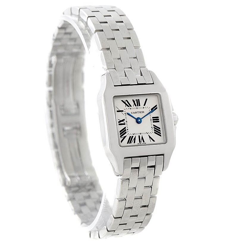 The image shows a Cartier Santos Demoiselle W25064Z5 Women
s Stainless Steel Silver Dial W25064Z5 Women
s Stainless Steel Silver Dial watch angled to display its face, bracelet, and part of the crown.