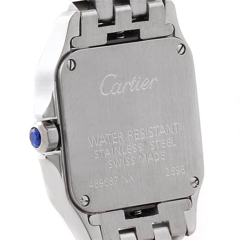 The image shows the back case of a Cartier Santos Demoiselle W25064Z5 Women
s Stainless Steel Silver Dial W25064Z5 Women
s Stainless Steel Silver Dial watch, highlighting its water-resistant stainless steel design and serial numbers.