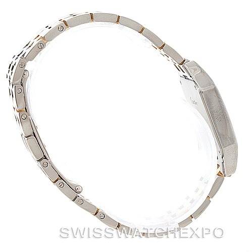 Side view of the Cartier Santos Demoiselle W25067Z6 Women's Steel and Gold (two tone) Silver Dial W25067Z6 Women's Steel and Gold (two tone) Silver Dial watch showing its metal bracelet and case.