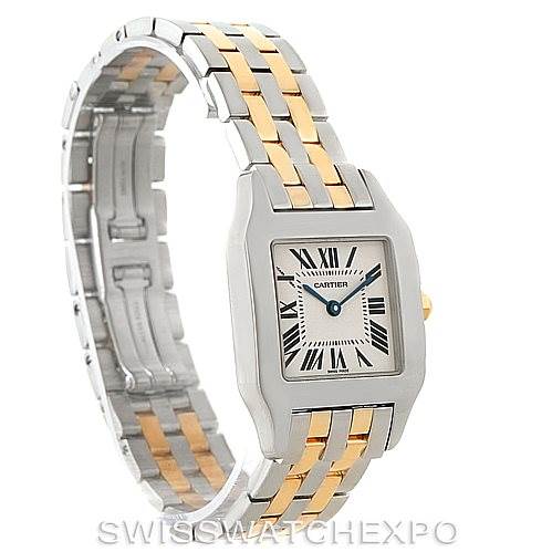The image shows a Cartier Santos Demoiselle W25067Z6 Women's Steel and Gold (two tone) Silver Dial W25067Z6 Women's Steel and Gold (two tone) Silver Dial watch at an angle highlighting its face, bezel, and metal two-tone band.