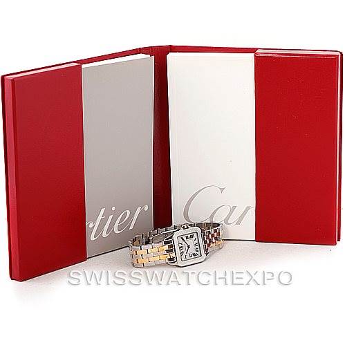 The image shows a Cartier Santos Demoiselle W25067Z6 Women's Steel and Gold (two tone) Silver Dial W25067Z6 Women's Steel and Gold (two tone) Silver Dial watch placed in front of an open red and white Cartier book.