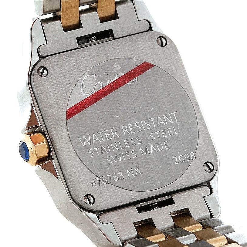 This image shows the back casing and part of the bracelet of a Cartier Santos Demoiselle W25066Z6 Women's Steel and Gold (two tone) Silver Dial W25066Z6 Women's Steel and Gold (two tone) Silver Dial watch.