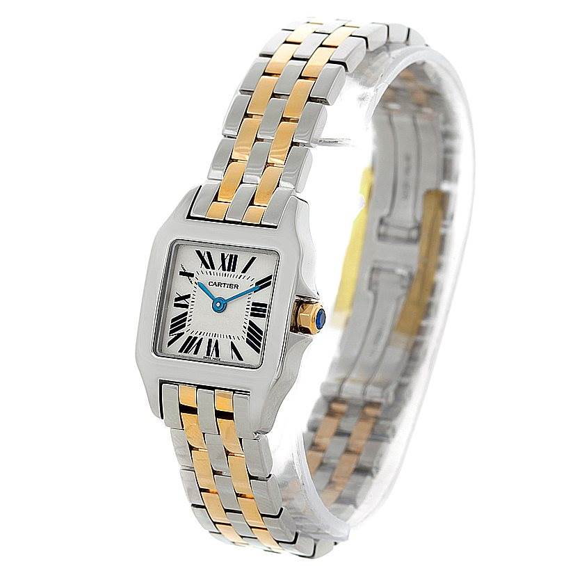 The image shows a front angle of a Cartier Santos Demoiselle W25066Z6 Women's Steel and Gold (two tone) Silver Dial W25066Z6 Women's Steel and Gold (two tone) Silver Dial watch, featuring its two-tone metal bracelet and square face with Roman numerals.
